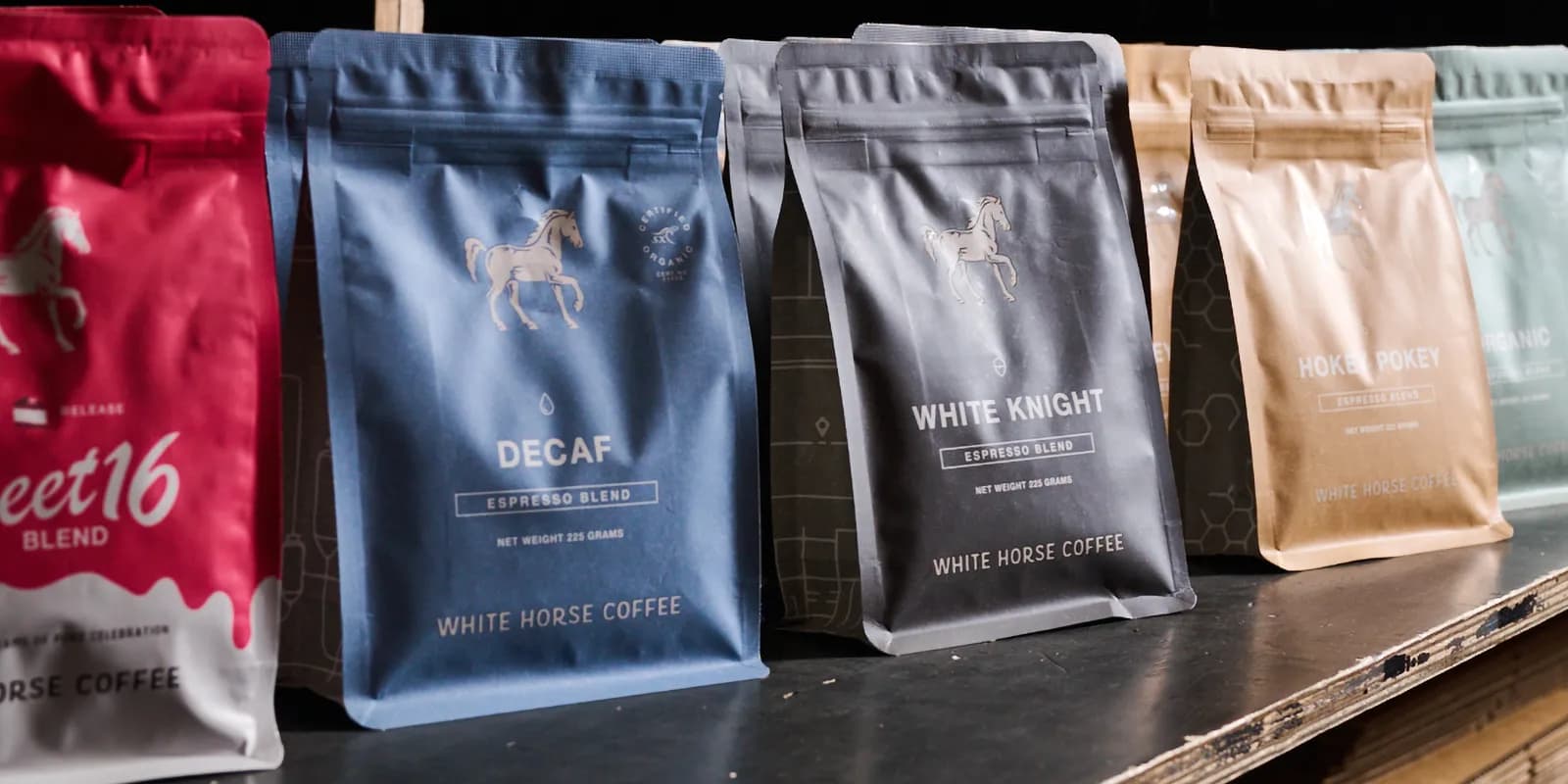 Assorted bags of coffee blends in various colours